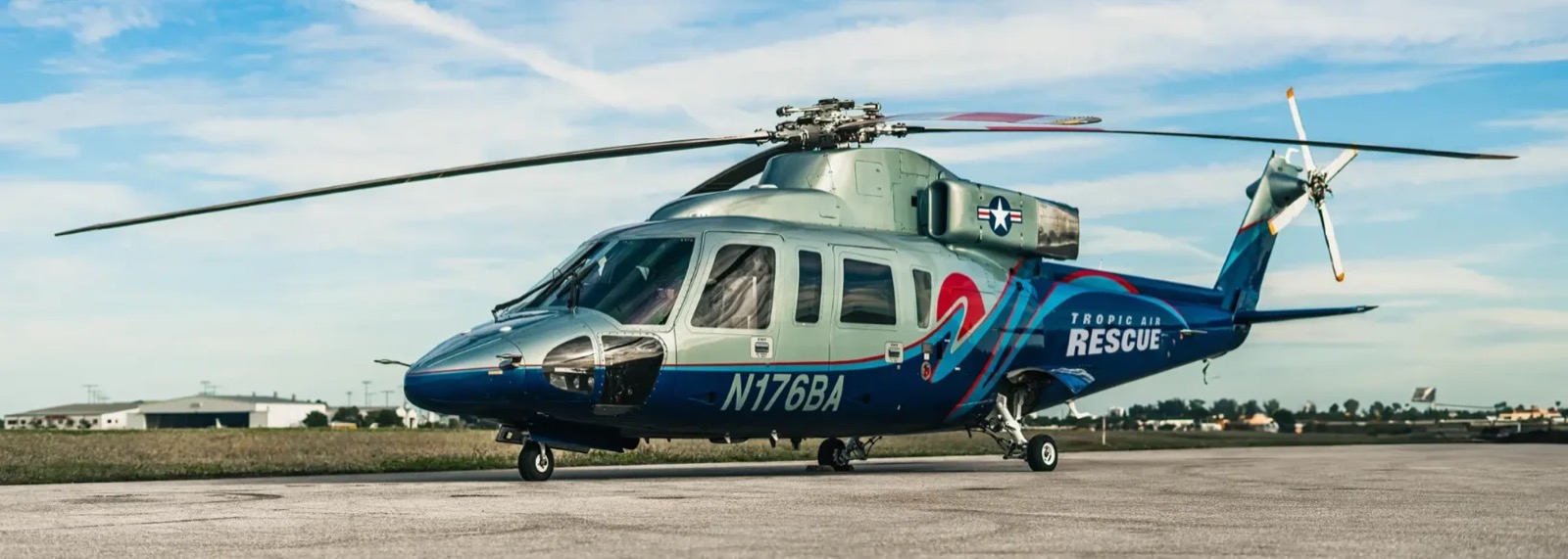 Tropic Air Rescue twin-engine Sikorsky S76 medical helicopter parked on a runway apron